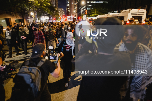 Pro-Palestine protesters hold a ''Make it Great Like '68'' protest in front of the Israeli consulate in Chicago, United States, on August 20...