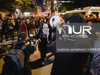 Pro-Palestine protesters hold a ''Make it Great Like '68'' protest in front of the Israeli consulate in Chicago, United States, on August 20...