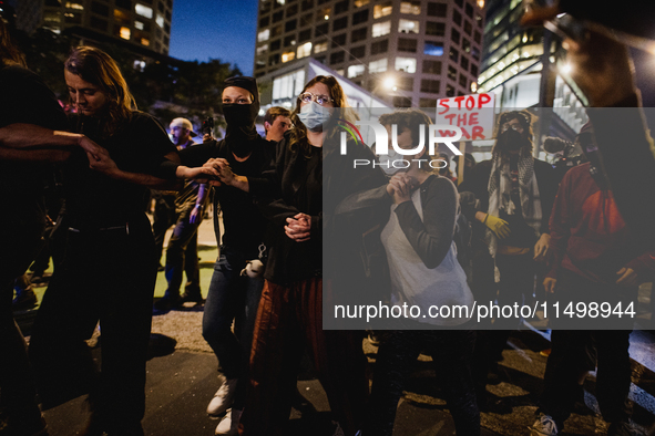 Pro-Palestine protesters hold a ''Make it Great Like '68'' protest in front of the Israeli consulate in Chicago, United States, on August 20...