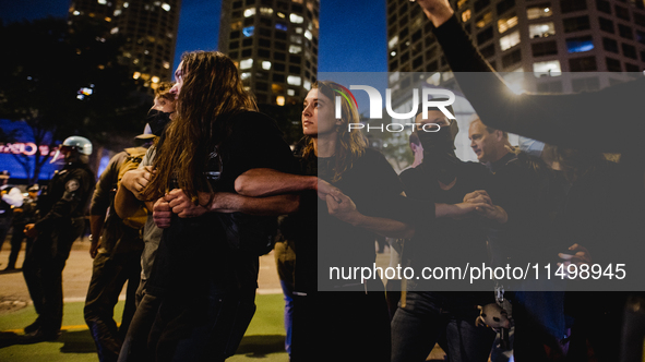 Pro-Palestine protesters hold a ''Make it Great Like '68'' protest in front of the Israeli consulate in Chicago, United States, on August 20...