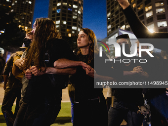 Pro-Palestine protesters hold a ''Make it Great Like '68'' protest in front of the Israeli consulate in Chicago, United States, on August 20...