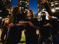 Pro-Palestine protesters hold a ''Make it Great Like '68'' protest in front of the Israeli consulate in Chicago, United States, on August 20...