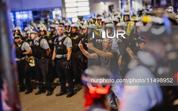 Pro-Palestine protesters hold a ''Make it Great Like '68'' protest in front of the Israeli consulate in Chicago, United States, on August 20...