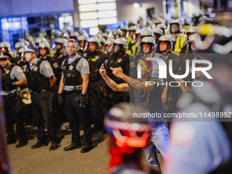 Pro-Palestine protesters hold a ''Make it Great Like '68'' protest in front of the Israeli consulate in Chicago, United States, on August 20...