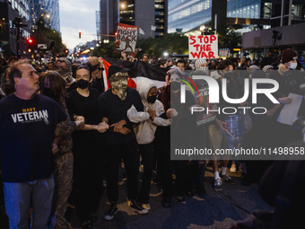 Pro-Palestine protesters hold a ''Make it Great Like '68'' protest in front of the Israeli consulate in Chicago, United States, on August 20...