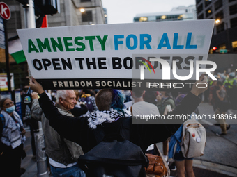 Pro-Palestine protesters hold a ''Make it Great Like '68'' protest in front of the Israeli consulate in Chicago, United States, on August 20...