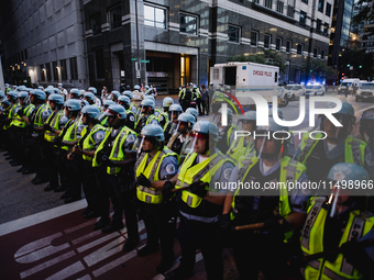 Pro-Palestine protesters hold a ''Make it Great Like '68'' protest in front of the Israeli consulate in Chicago, United States, on August 20...