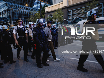 Pro-Palestine protesters hold a ''Make it Great Like '68'' protest in front of the Israeli consulate in Chicago, United States, on August 20...