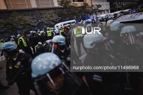 Pro-Palestine protesters hold a ''Make it Great Like '68'' protest in front of the Israeli consulate in Chicago, United States, on August 20...