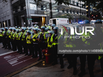 Pro-Palestine protesters hold a ''Make it Great Like '68'' protest in front of the Israeli consulate in Chicago, United States, on August 20...