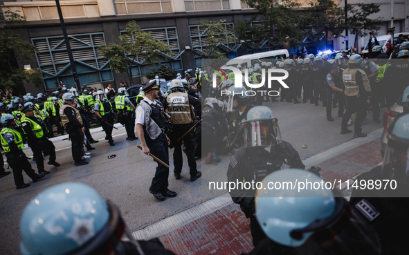 Pro-Palestine protesters hold a ''Make it Great Like '68'' protest in front of the Israeli consulate in Chicago, United States, on August 20...