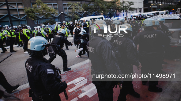 Pro-Palestine protesters hold a ''Make it Great Like '68'' protest in front of the Israeli consulate in Chicago, United States, on August 20...