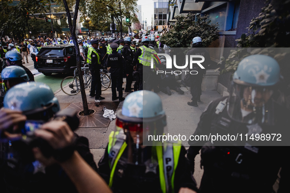 Pro-Palestine protesters hold a ''Make it Great Like '68'' protest in front of the Israeli consulate in Chicago, United States, on August 20...