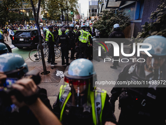 Pro-Palestine protesters hold a ''Make it Great Like '68'' protest in front of the Israeli consulate in Chicago, United States, on August 20...