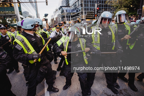 Pro-Palestine protesters hold a ''Make it Great Like '68'' protest in front of the Israeli consulate in Chicago, United States, on August 20...