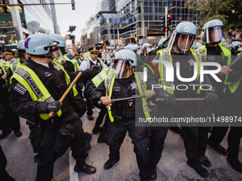 Pro-Palestine protesters hold a ''Make it Great Like '68'' protest in front of the Israeli consulate in Chicago, United States, on August 20...