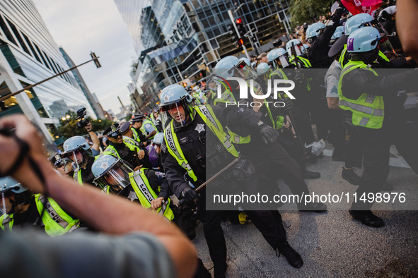 Pro-Palestine protesters hold a ''Make it Great Like '68'' protest in front of the Israeli consulate in Chicago, United States, on August 20...