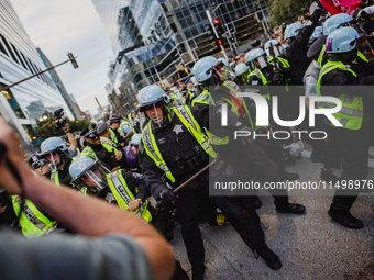 Pro-Palestine protesters hold a ''Make it Great Like '68'' protest in front of the Israeli consulate in Chicago, United States, on August 20...