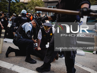 Pro-Palestine protesters hold a ''Make it Great Like '68'' protest in front of the Israeli consulate in Chicago, United States, on August 20...