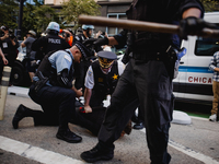 Pro-Palestine protesters hold a ''Make it Great Like '68'' protest in front of the Israeli consulate in Chicago, United States, on August 20...