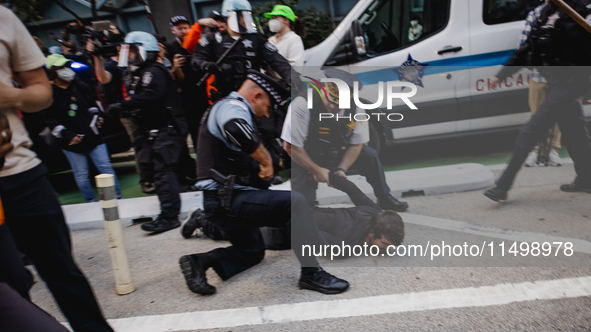 Pro-Palestine protesters hold a ''Make it Great Like '68'' protest in front of the Israeli consulate in Chicago, United States, on August 20...