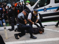 Pro-Palestine protesters hold a ''Make it Great Like '68'' protest in front of the Israeli consulate in Chicago, United States, on August 20...