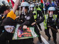 Pro-Palestine protesters hold a ''Make it Great Like '68'' protest in front of the Israeli consulate in Chicago, United States, on August 20...