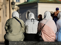 Tourists from the Middle East are seen on the Main Square in Krakow, Poland, on August 13, 2024. (