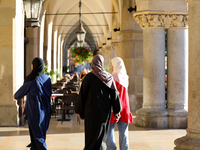 Tourists from the Middle East are seen on the Main Square in Krakow, Poland, on August 13, 2024. (