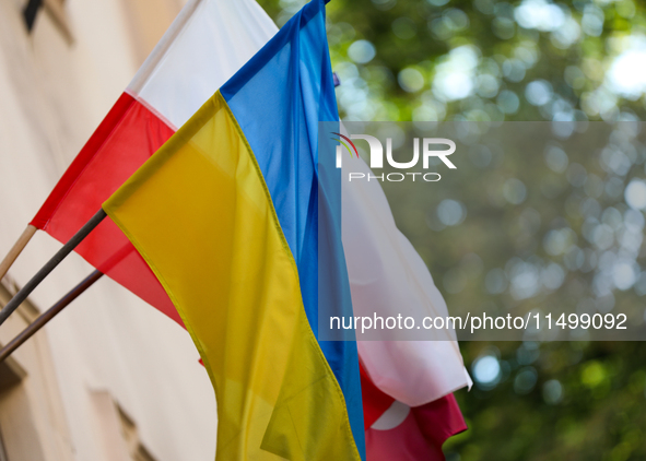 A Ukrainian flag with a Polish flag is seen on the street in Krakow, Poland, on August 13, 2024. 