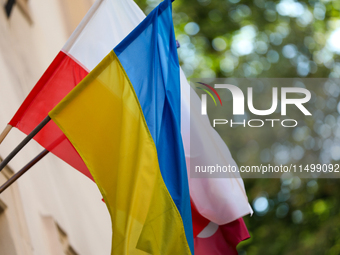 A Ukrainian flag with a Polish flag is seen on the street in Krakow, Poland, on August 13, 2024. (