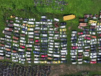 An aerial photo taken on August 22, 2024, shows a large number of cars and motorcycles waiting to be dismantled at a scrap point for discard...