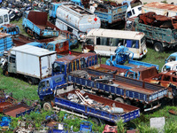 An aerial photo taken on August 22, 2024, shows a large number of cars and motorcycles waiting to be dismantled at a scrap point for discard...