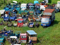 An aerial photo taken on August 22, 2024, shows a large number of cars and motorcycles waiting to be dismantled at a scrap point for discard...