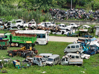 An aerial photo taken on August 22, 2024, shows a large number of cars and motorcycles waiting to be dismantled at a scrap point for discard...