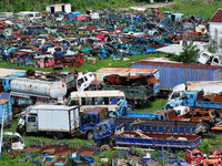 An aerial photo taken on August 22, 2024, shows a large number of cars and motorcycles waiting to be dismantled at a scrap point for discard...