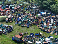 An aerial photo taken on August 22, 2024, shows a large number of cars and motorcycles waiting to be dismantled at a scrap point for discard...