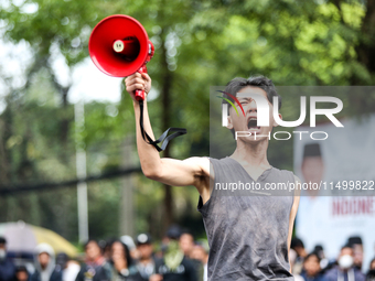 A student gives a speech during a demonstration to reject the ratification of the Regional Head Election (Pilkada) Bill in front of the West...