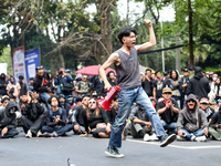 A student gives a speech during a demonstration to reject the ratification of the Regional Head Election (Pilkada) Bill in front of the West...