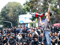 A student gives a speech during a demonstration to reject the ratification of the Regional Head Election (Pilkada) Bill in front of the West...