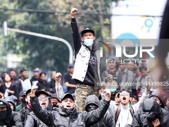 Students shout during a demonstration to reject the ratification of the Regional Head Election (Pilkada) Bill in front of the West Java DPRD...