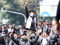 Students shout during a demonstration to reject the ratification of the Regional Head Election (Pilkada) Bill in front of the West Java DPRD...