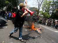 A student gives a speech during a demonstration to reject the ratification of the Regional Head Election (Pilkada) Bill in front of the West...