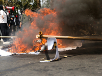 A student gives a speech during a demonstration to reject the ratification of the Regional Head Election (Pilkada) Bill in front of the West...