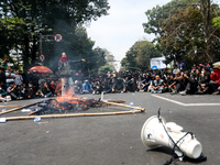 A student gives a speech during a demonstration to reject the ratification of the Regional Head Election (Pilkada) Bill in front of the West...