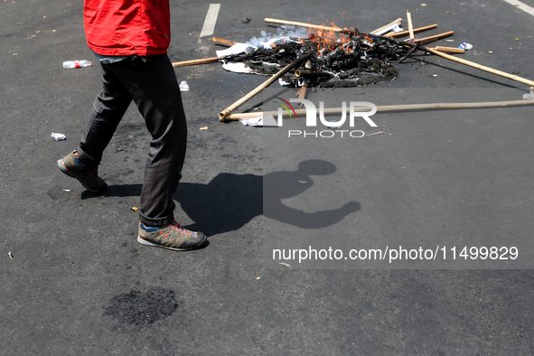 A student gives a speech during a demonstration to reject the ratification of the Regional Head Election (Pilkada) Bill in front of the West...