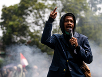 A student gives a speech during a demonstration to reject the ratification of the Regional Head Election (Pilkada) Bill in front of the West...