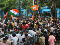 Bharatiya Janata Party (BJP) participates in a protest rally marching to the Health Headquarters and crosses the police barricade in protest...