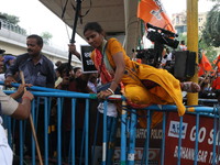 Bharatiya Janata Party (BJP) participates in a protest rally marching to the Health Headquarters and crosses the police barricade in protest...