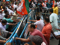 Bharatiya Janata Party (BJP) participates in a protest rally marching to the Health Headquarters and crosses the police barricade in protest...